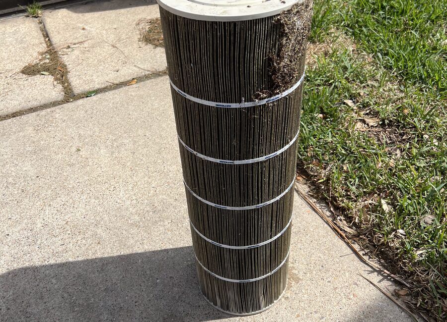 Pool filter cartridge being deep-cleaned by Retro Ink Pools