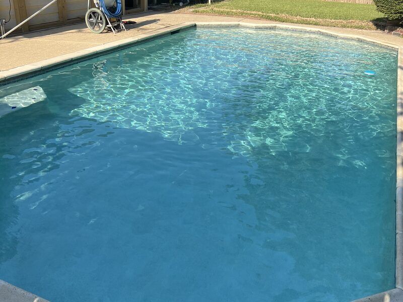 Modern backyard pool kept crystal clear in Katy TX