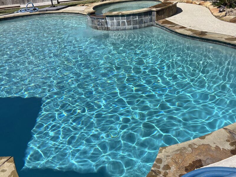 Turquoise crystal clear pool maintained weekly